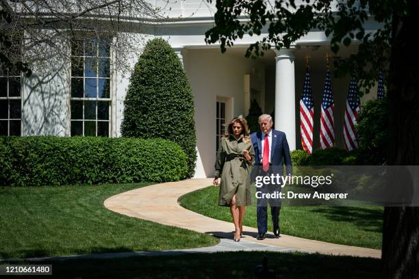 President Donald Trump and first lady Melania Trump exit the Oval Office as they arrive to participate in a tree planting ceremony in recognition of...