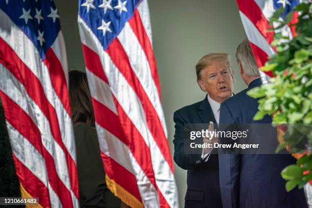 President Donald Trump speaks with House Minority Leader Kevin McCarthy outside of the Oval Office after a tree planting ceremony in recognition of...