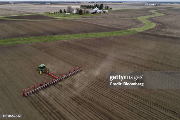 Corn is planted in this aerial photograph taken above a field outside Henry, Illinois, U.S., on Monday, April 20, 2020. Corn and sugar futures...