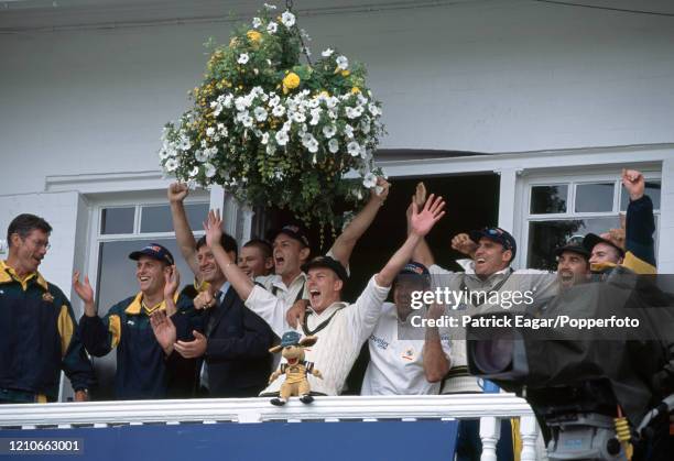 The Australia squad celebrates as the team wins the 3rd Test match between England and Australia to retain the Ashes at Trent Bridge, Nottingham, 4th...