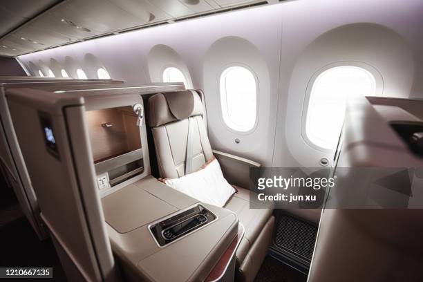 luxurious seats inside the plane - first class plane stockfoto's en -beelden
