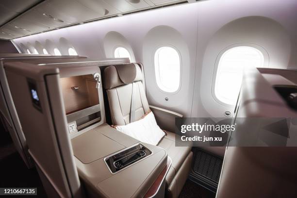 luxurious seats inside the plane - first class plane stock pictures, royalty-free photos & images