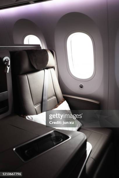 luxurious seats inside the plane - first class plane stock-fotos und bilder