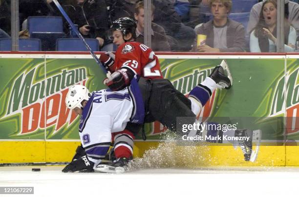 Buffalo Sabres right wing Jason Pominville and Los Angeles Kings center Sean Avery battle for the puck in a game at HSBC Arena in Buffalo, New York...