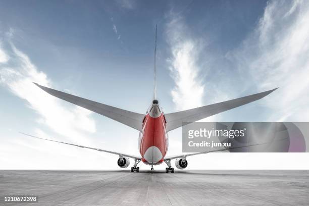 a huge plane on the runway of an airport - plane taking off stock-fotos und bilder