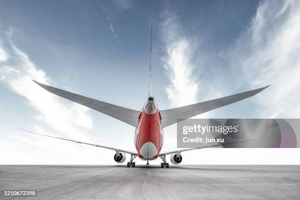 a huge plane on the runway of an airport - airport traffic stockfoto's en -beelden