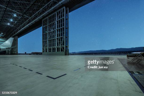 hangar runway under the stars - weltraum flughafen stock-fotos und bilder