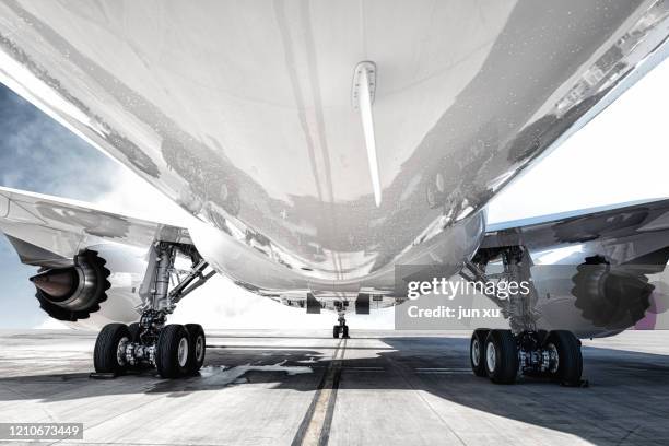 the airport is loading the plane with supplies - aeroplane close up stock pictures, royalty-free photos & images