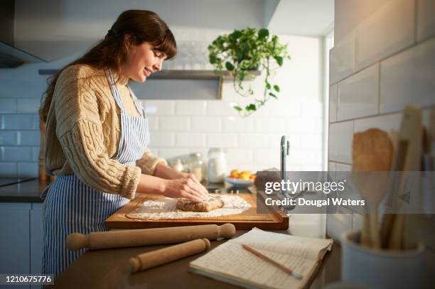 woman making pastry in zero waste kitchen. - wooden spoon stock pictures, royalty-free photos & images