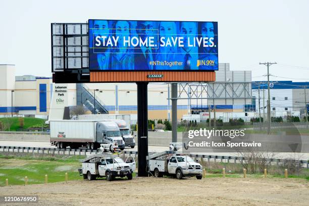 Stay Home. Save Lives." is one of the Indiana government public service announcements displayed on this electronic billboard adjacent to Interstate...