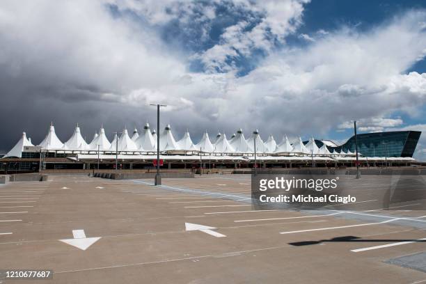 Parking lot at Denver International Airport sits empty as the coronavirus pandemic slows air travel on April 22, 2020 in Denver, Colorado. Compared...