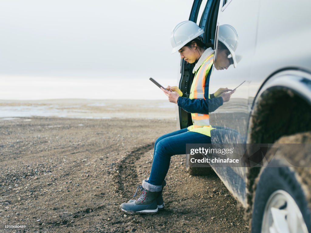 Female oil Worker using  tablet pc