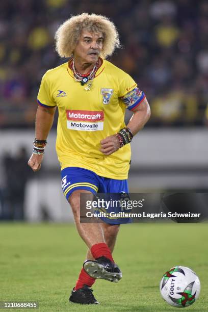 Carlos Valderrama of Colombia legends drives the ball during an exhibition match between Colombia legends and Barcelona legends at Estadio El Campin...