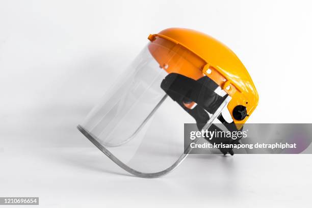 orange protective mask isolated on the white background. - ropa protectora deportiva fotografías e imágenes de stock