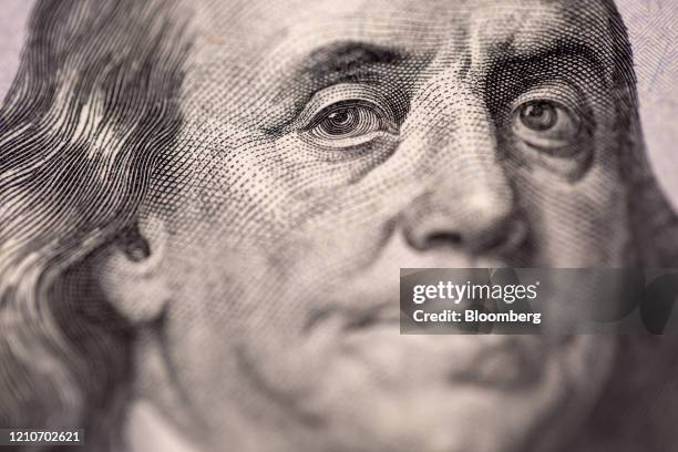 The portrait of U.S. Founding father Benjamin Franklin is displayed on a U.S. One-hundred dollar banknote in an arranged photograph taken in Hong...