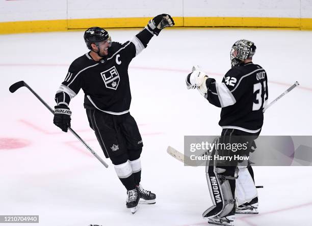 Anze Kopitar of the Los Angeles Kings celebrates an overtime shootout win over the Toronto Maple Leafs with Jonathan Quick at Staples Center on March...