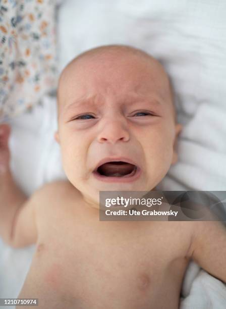 In this photo illustration a baby is crying on April 21, 2020 in Bonn, Germany.