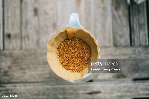 ready for drip coffee, barista will pour water on coffee ground with filter - ground coffee stock pictures, royalty-free photos & images