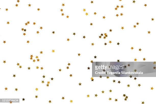bunch of gold stars on white background. - decoración de navidad fotografías e imágenes de stock