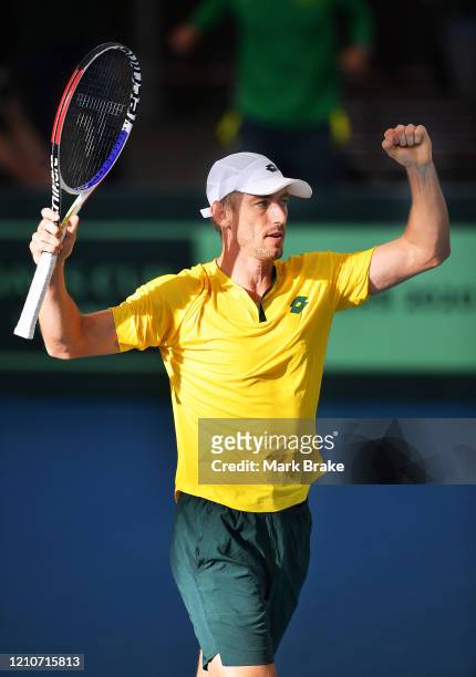 John Millman of Australia celebrates winning the match during the Davis Cup Qualifier Tie singles match between John Millman of Australia and Thiago...