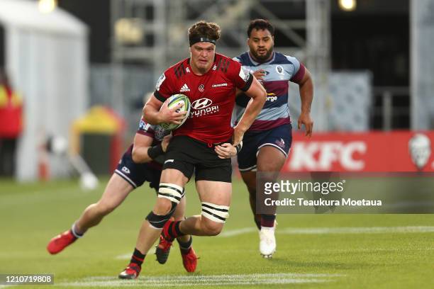 Scott Barrett of the Crusaders is tackled during the round six Super Rugby match between the Crusaders and the Reds at Orangetheory Stadium on March...