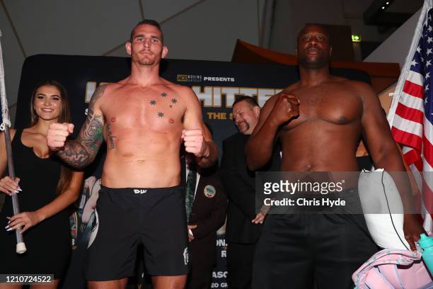 Demsey McKean of Australia and Jonathan Rice of The United States face off during the Heavy Hitters Fight Night Weigh In at The Star Gold Coast on...