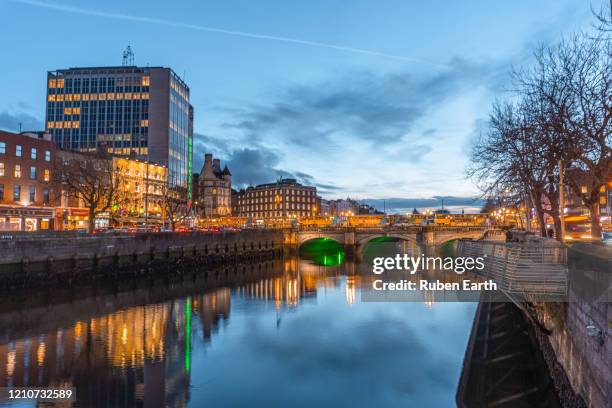 dublin temple bar city center and o'connell bridge after sunset. - dublin historic stock pictures, royalty-free photos & images