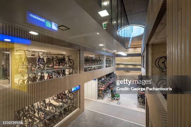 interior of the world's largest bicycle parking garage in utrecht, holland - utrecht stock-fotos und bilder