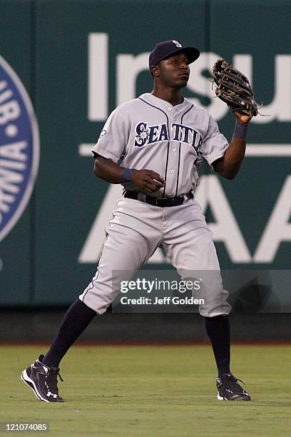 Trayvon Robinson of the Seattle Mariners makes his second catch to record an out in his Major League debut against the Los Angeles Angels of Anaheim...