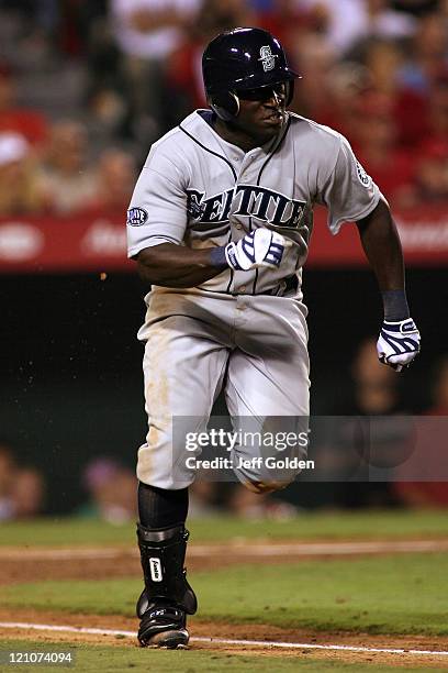 Trayvon Robinson of the Seattle Mariners makes his third plate appearance in his Major League debut as he runs to first base while grounding into a...