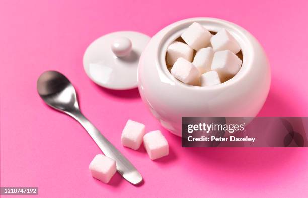 sugar cubes in sugar bowl - sugar bowl stock pictures, royalty-free photos & images