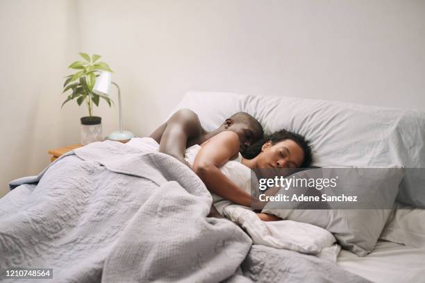 lovers sleeping tight... - romantic young couple sleeping in bed stock pictures, royalty-free photos & images