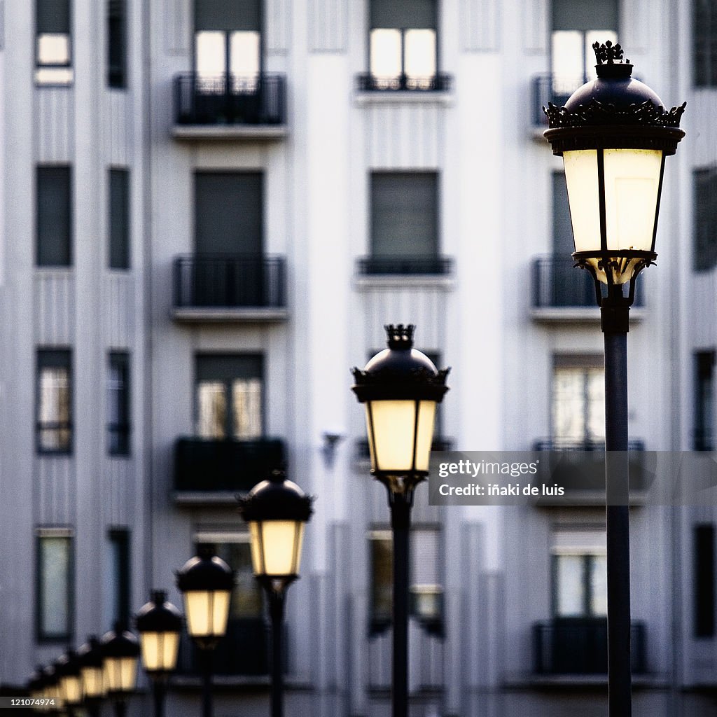Sun illuminates streetlights and windows