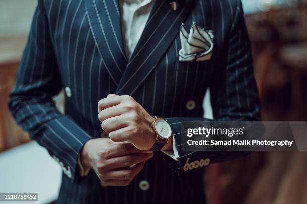wrist watch - arab businessman stock pictures, royalty-free photos & images