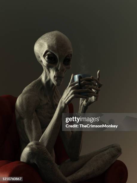 portrait of an alien drinking hot beverage - grey aliens stock pictures, royalty-free photos & images