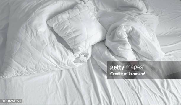 messy bed on morning - bedding stock pictures, royalty-free photos & images