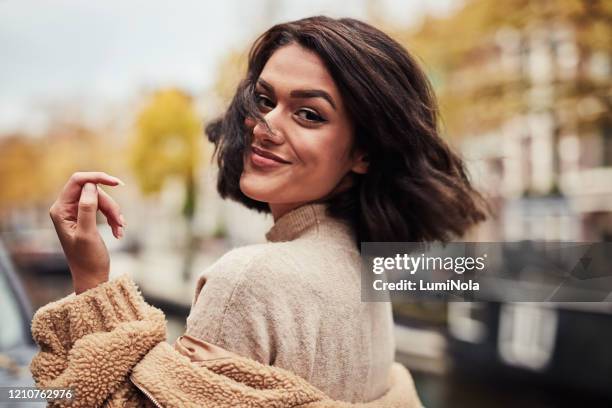 amsterdam is great, but she’s even better - tossing hair facing camera woman outdoors stock pictures, royalty-free photos & images