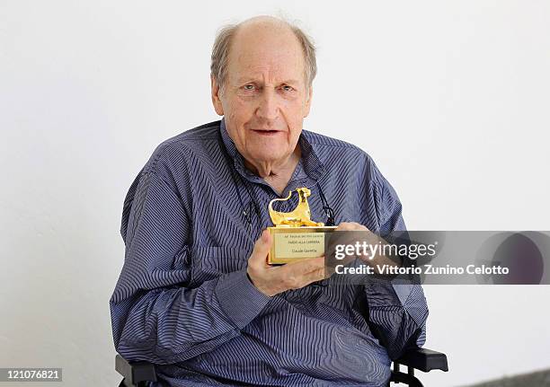 Director Claude Goretta poses with the 'Pardo alla Carriera' during the 64th Festival del Film di Locarno on August 13, 2011 in Locarno, Switzerland.