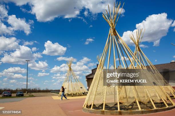 Man walks outside the Administration Center at the Lower Brule Indian Reservation on April 22, 2020 in Lower Brule, South Dakota. - The threat posed...