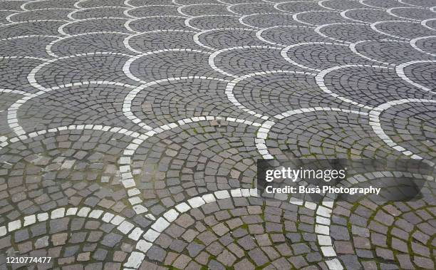 decoration of cobblestone floor tiles in italy - pisa italy stock pictures, royalty-free photos & images