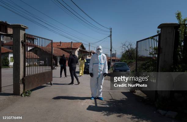 Health working wearing a hazmat suit near a testing site for COVID-19 in the Roma neighborhood of Fakulteta in Sofia, Bulgaria on April 23, 2020....