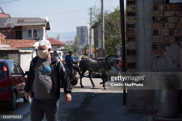 Man wearing a mask in Fakulteta, a Roma neighborhood in Sofia, Bulgaria on April 23, 2020. Fakulteta is one of two Roma neighborhoods quarantined...