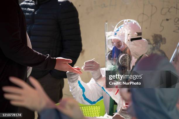 Health workers take blood to perform fast antibody tests in Fakulteta, a Roma neighborhood in Sofia, Bulgaria on April 23, 2020. Fakulteta is one of...