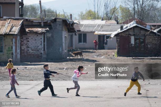 Children play at game pretending they are driving a horse cart in Fakulteta, the biggest Roma neighborhood in the capital Sofia. Health workers set...