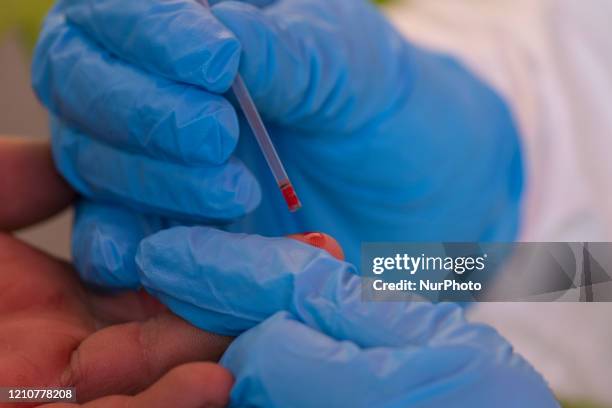 Health workers performing an antibody test in the primarily Roma neighborhood of Fakulteta in Sofia, Bulgaria on April 23, 2020. Free antibody and...