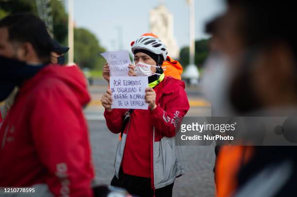 Bicycle delivery workers strike demanding better wages and hygiene materials, gloves, tapabocas and gel alcohol on April 23, 2020 in Buenos Aires,...
