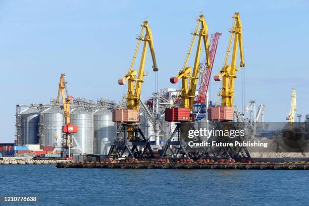 Container cranes are situated next to grain silos at the Odesa Sea Port, Odesa, southern Ukraine. - PHOTOGRAPH BY Ukrinform / Future Publishing
