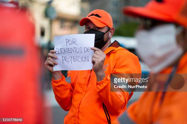 Bicycle delivery workers strike demanding better wages and hygiene materials, gloves, tapabocas and gel alcohol on April 23, 2020 in Buenos Aires,...