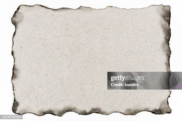 old paper with burned edges on white background. - page divider stock pictures, royalty-free photos & images