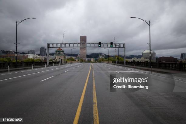 The Burnside Bridge is seen empty during rush hour in Portland, Oregon, U.S., on Wednesday, April 22, 2020. Governors of California, Oregon and...